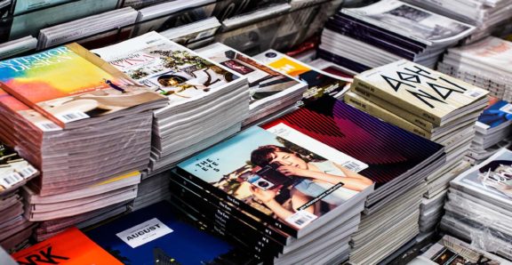 Rows of magazines on a stand